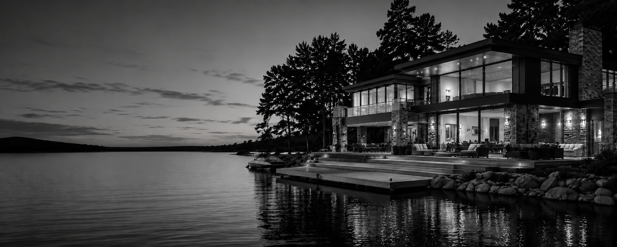 Modern North Carolina lakefront home reflected in the water at dusk